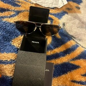 Prada sunglasses they were gifted I never wore them because I didn’t like them.